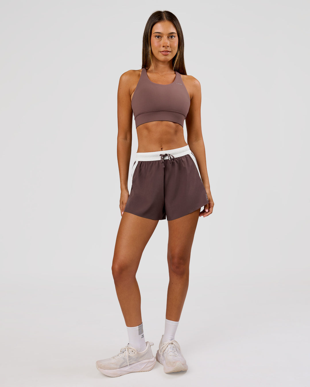 Woman wearing Accelerate Sports Bra - Cocoa Powder | Model:Charli | Size:XS - view 4