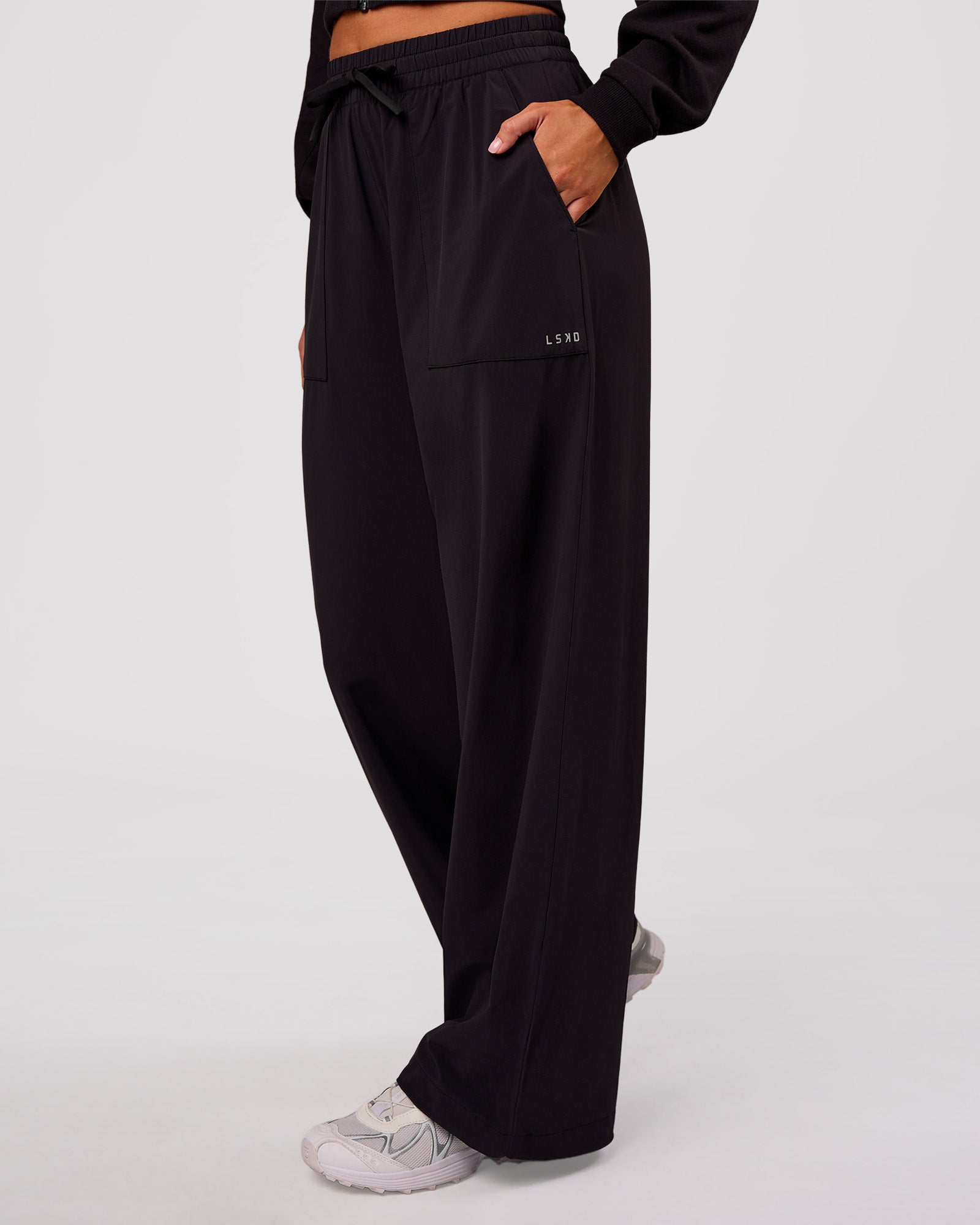 Woman wearing Bend Woven Pant - Black | Model:Charli | Size:XS