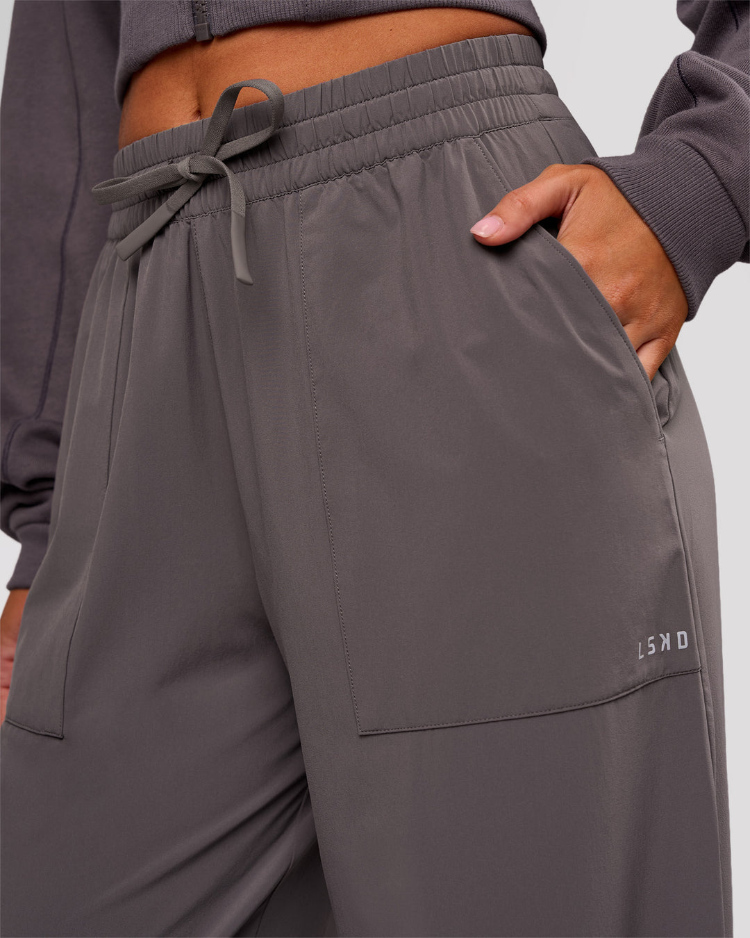 Woman wearing Bend Woven Pant - Duskstone | Model:Charli | Size:XS - view 6