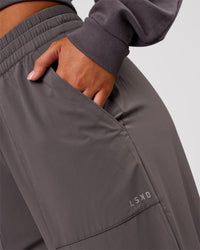 Woman wearing Bend Woven Pant - Duskstone | Model:Charli | Size:XS | Thumbnail Index: 12