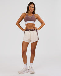 Woman wearing Elevated Accelerate Sports Bra - Cocoa Power-White | Model:Charli | Size:XS | Thumbnail Index: 4