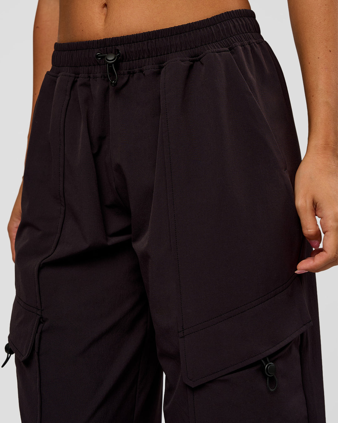 Woman wearing Endeavour Cargo Pant - Black | Model:Charli | Size:XS - view 3