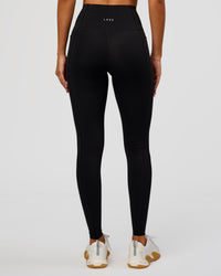 Woman wearing Fusion Bonded High-Rise Full Length Legging Pockets - Black | Model:Charli | Size:XS | Thumbnail Index: 6