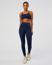 Woman wearing O.G. Fusion Ultra High-Rise Full Length Legging Pockets - Future Navy | Model:Charli | Size:XS | Thumbnail Index: 0