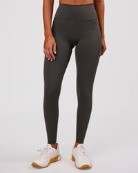 Woman wearing Fusion Ultra High-Rise Full Length Legging Pockets - Onyx | Model:Charli | Size:XS | Thumbnail Index: 2