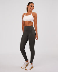 Woman wearing Fusion Ultra High-Rise Full Length Legging Pockets - Onyx | Model:Charli | Size:XS | Thumbnail Index: 3