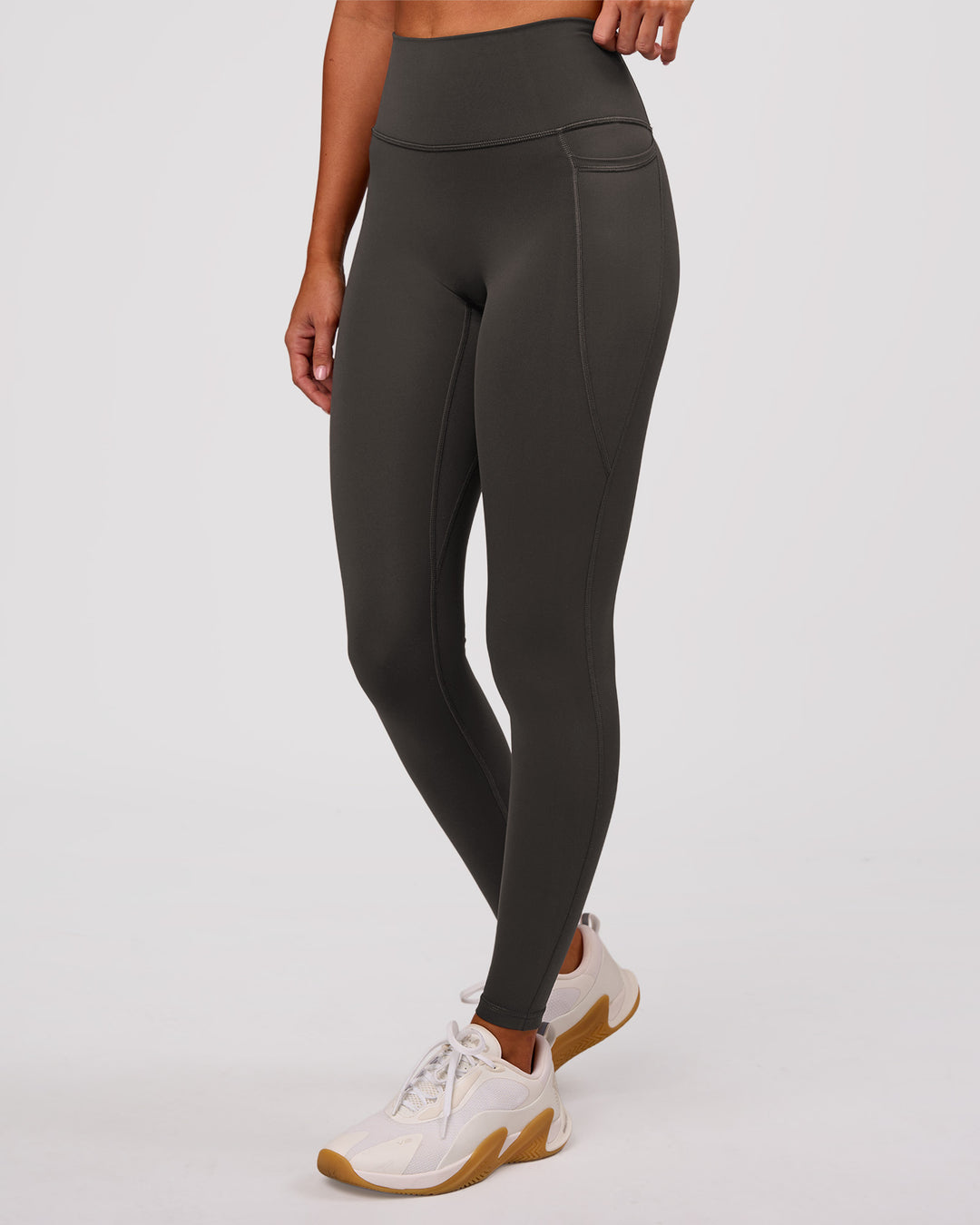 Woman wearing Fusion Ultra High-Rise Full Length Legging Pockets - Onyx | Model:Charli | Size:XS - view 5