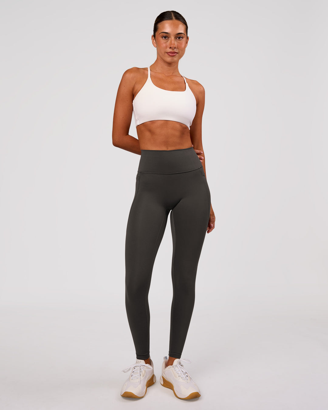 Woman wearing Fusion Ultra High-Rise Full Length Legging Pockets - Onyx | Model:Charli | Size:XS - view 1