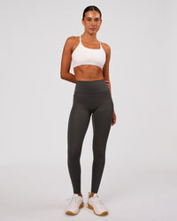 Woman wearing Fusion Ultra High-Rise Full Length Legging Pockets - Onyx | Model:Charli | Size:XS | Thumbnail Index: 0