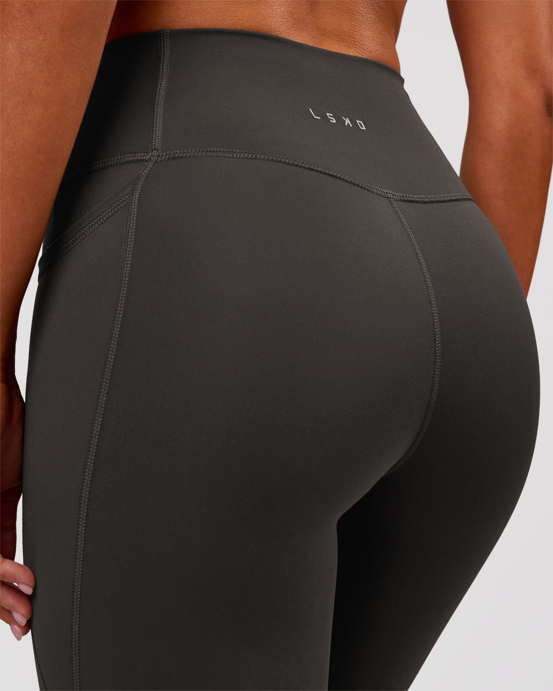 Woman wearing Fusion Ultra High-Rise Full Length Legging Pockets - Onyx | Model:Charli | Size:XS - view 6