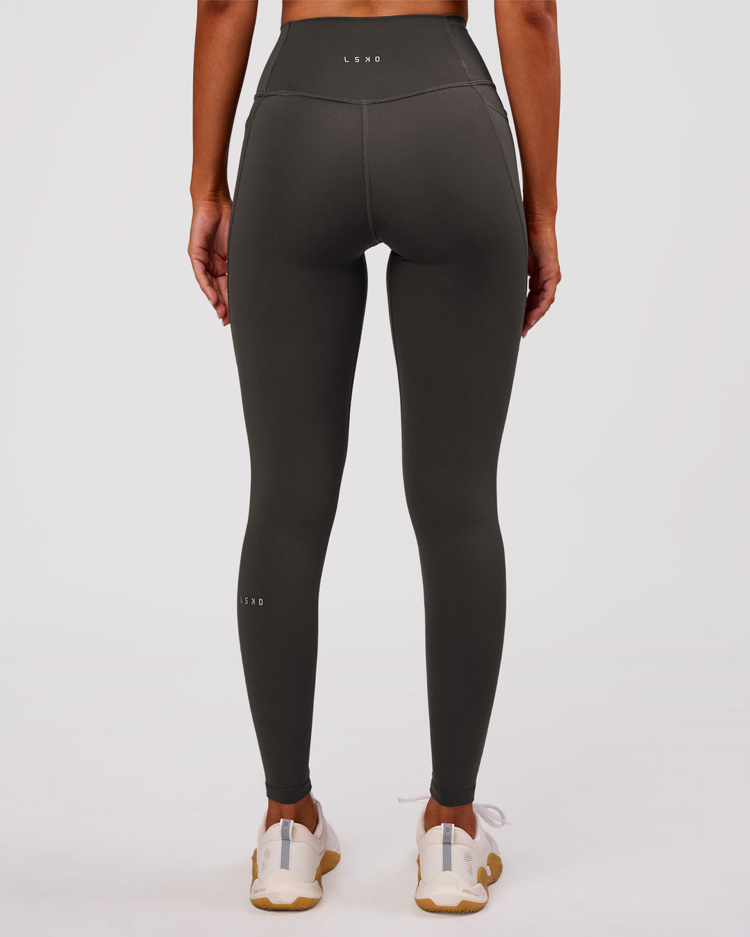 Woman wearing Fusion Ultra High-Rise Full Length Legging Pockets - Onyx | Model:Charli | Size:XS - view 8