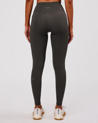 Woman wearing Fusion Ultra High-Rise Full Length Legging Pockets - Onyx | Model:Charli | Size:XS | Thumbnail Index: 7