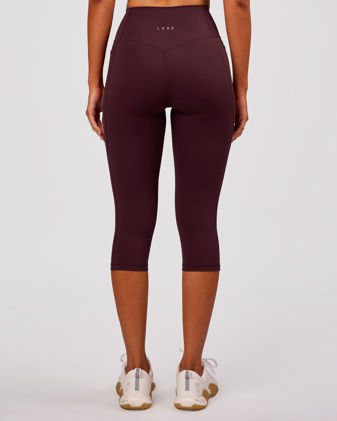 Woman wearing Fusion V Contour Ultra High-Rise 3/4 Legging Pockets - Cherry Lacquer | Model:Charli | Size:XS - view 8
