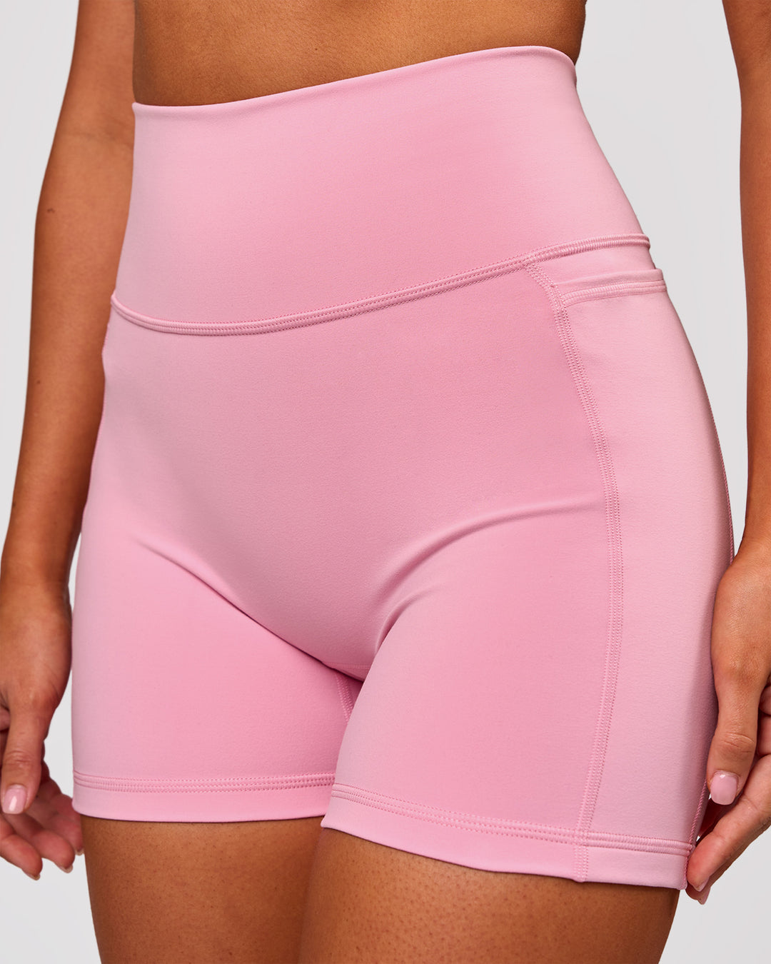 Woman wearing Fusion V-Contour Ultra High-Rise 4" Short Pockets - Pink Rose | Model:Charli | Size:XS - view 4