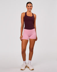 Woman wearing Fusion V-Contour Ultra High-Rise 4" Short Pockets - Pink Rose | Model:Charli | Size:XS | Thumbnail Index: 8