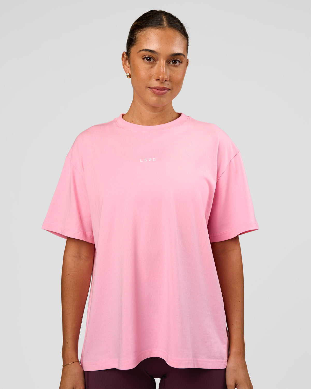 Woman wearing Go-To FLXCotton Oversized Tee - Pink Rose-White | Model:Charli | Size:XS