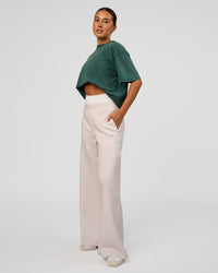 Woman wearing Go-To FLXCotton Oversized Tee - Transformative Teal Washed-White | Model:Charli | Size:XS