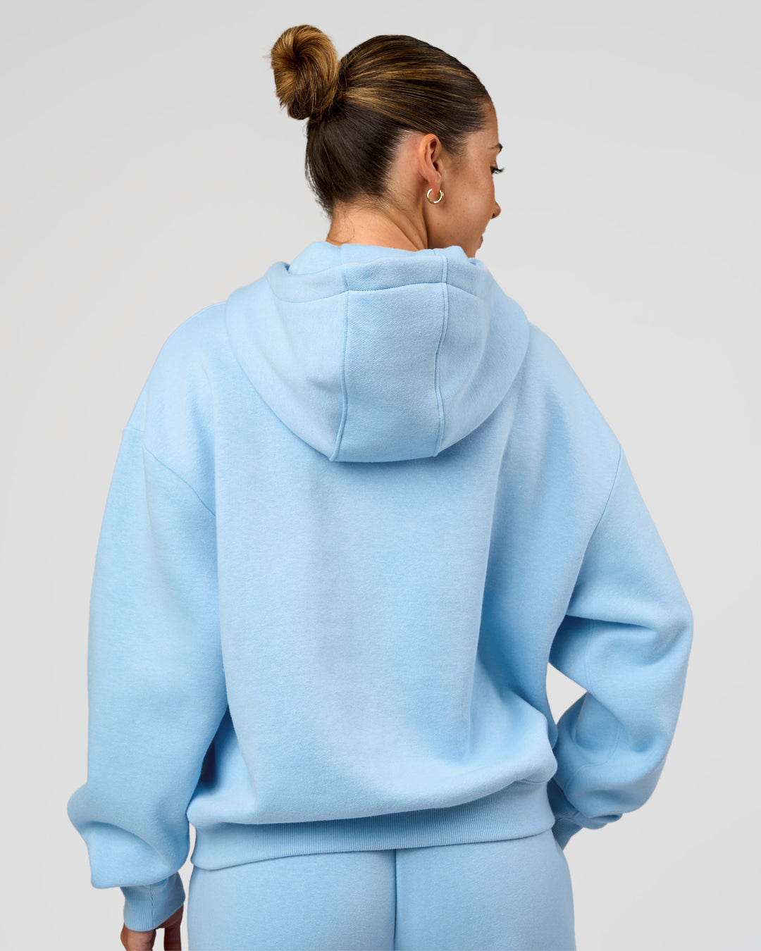 Woman wearing Go-To Script Oversized Hoodie - Open Air | Model:Charli | Size:XS