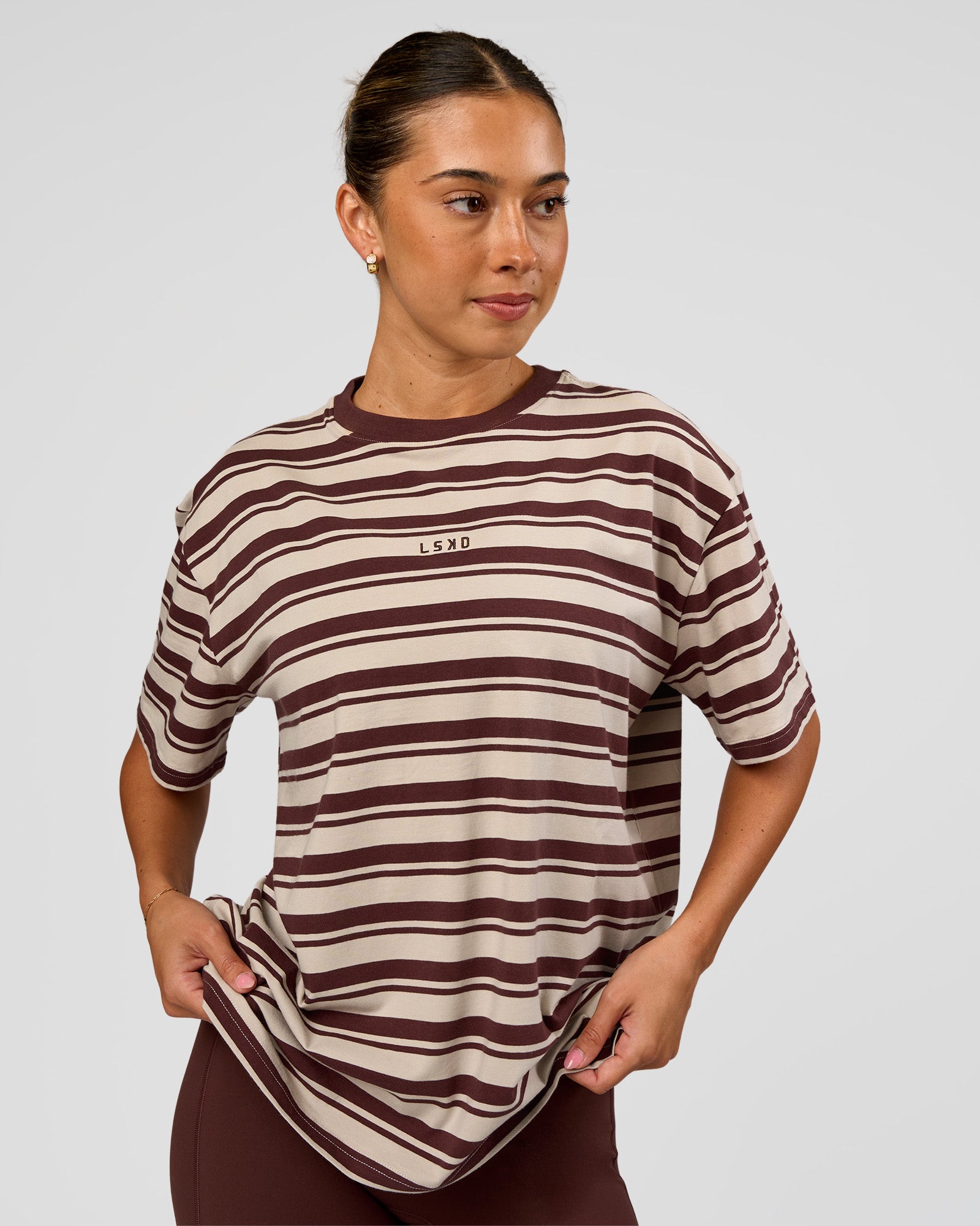 Woman wearing Go-To Shadow Stripe FLXCotton Oversized Tee - Shale Beige-Hot Chocolate | Model:Charli | Size:XS