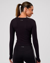 Woman wearing Horizon Long Sleeve Tee - Black | Model:Charli | Size:XS | Thumbnail Index: 9