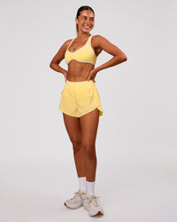 Woman wearing Luminous Sports Bra - Lemon-White | Model:Charli | Size:XS | Thumbnail Index: 5