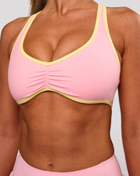 Woman wearing Luminous Sports Bra - Pink Rose-Lemon | Model:Charli | Size:XS | Thumbnail Index: 0