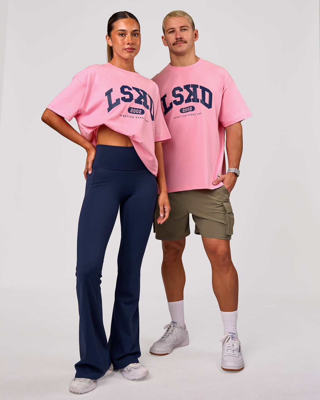 Woman wearing Varsity EST Heavyweight Oversized Tee  - Pink Rose-Future Navy | Model:Charli | Size:XS - view 2