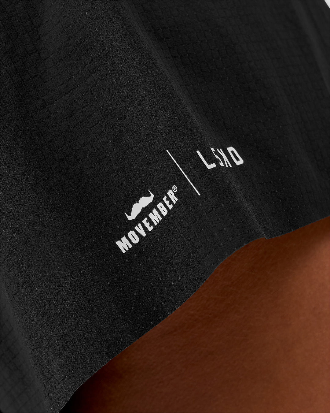 Woman wearing Movember x LSKD Accelerate 3" High-Rise Running Short - Black | Model:Charli | Size:XS - view 6