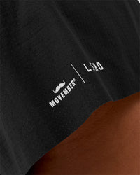 Woman wearing Movember x LSKD Accelerate 3" High-Rise Running Short - Black | Model:Charli | Size:XS | Thumbnail Index: 5