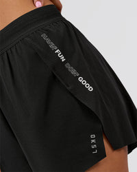 Woman wearing Movember x LSKD Accelerate 3" High-Rise Running Short - Black | Model:Charli | Size:XS | Thumbnail Index: 7