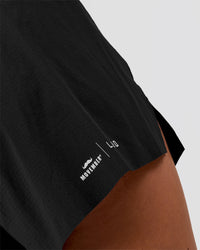 Woman wearing Movember x LSKD Accelerate 3" High-Rise Running Short - Black | Model:Charli | Size:XS | Thumbnail Index: 10