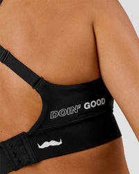 Woman wearing Movember x LSKD Accelerate Sports Bra - Black | Model:Charli | Size:XS | Thumbnail Index: 5