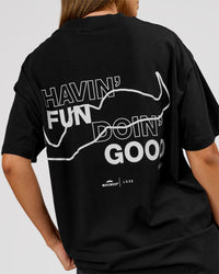 Woman wearing Movember x LSKD FLXCotton Oversize Tee - Black-White | Model:Charli | Size:XS | Thumbnail Index: 16
