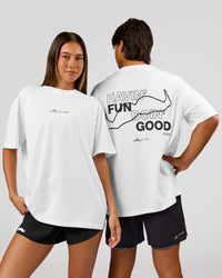 Woman wearing Movember x LSKD FLXCotton Oversize Tee - White-Black | Model:Charli | Size:XS | Thumbnail Index: 1