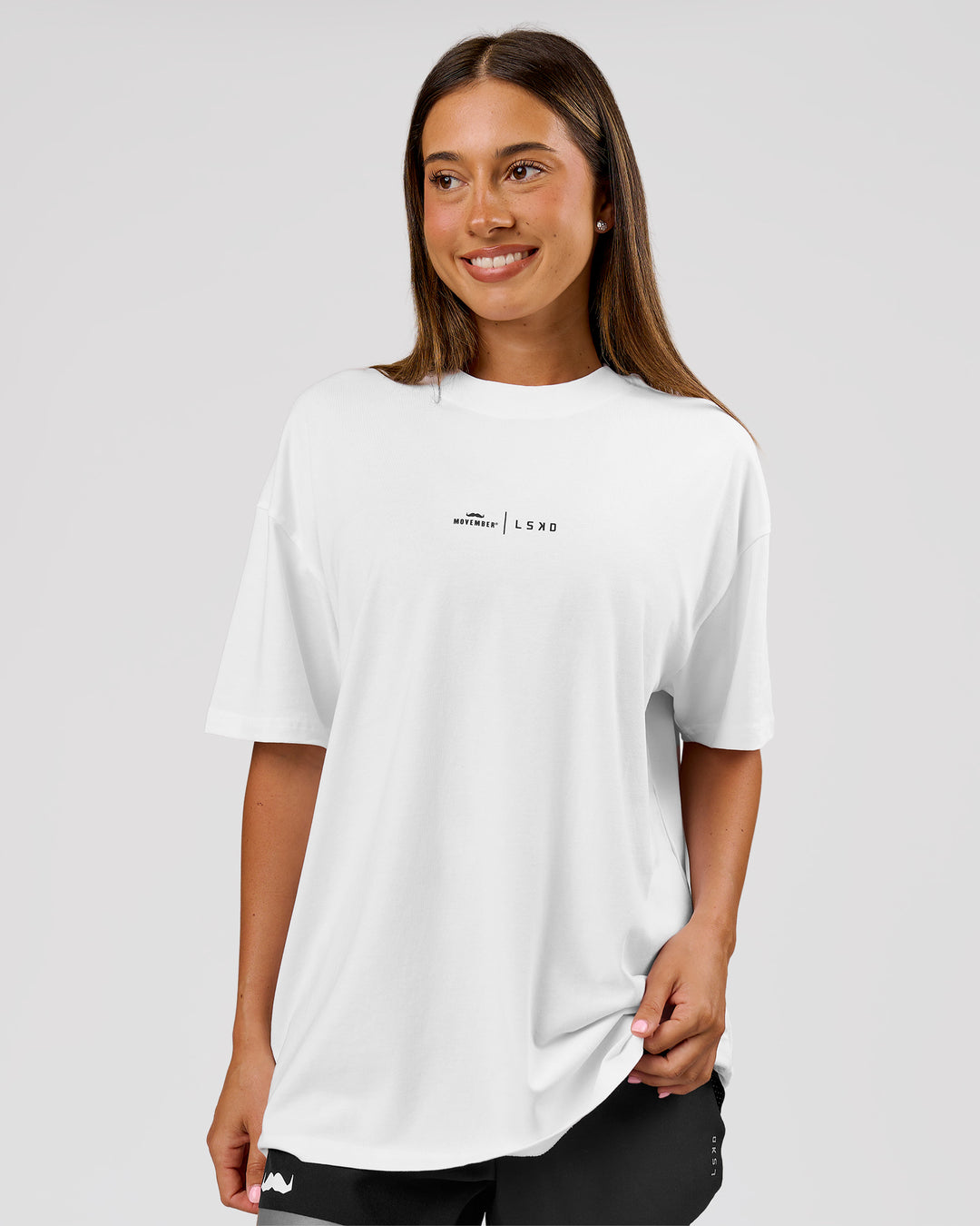 Woman wearing Movember x LSKD FLXCotton Oversize Tee - White-Black | Model:Charli | Size:XS - view 6