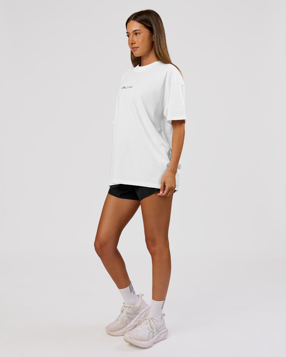 Woman wearing Movember x LSKD FLXCotton Oversize Tee - White-Black | Model:Charli | Size:XS - view 12