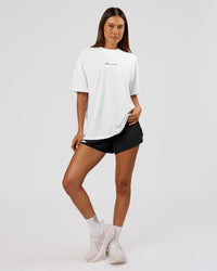 Woman wearing Movember x LSKD FLXCotton Oversize Tee - White-Black | Model:Charli | Size:XS | Thumbnail Index: 13
