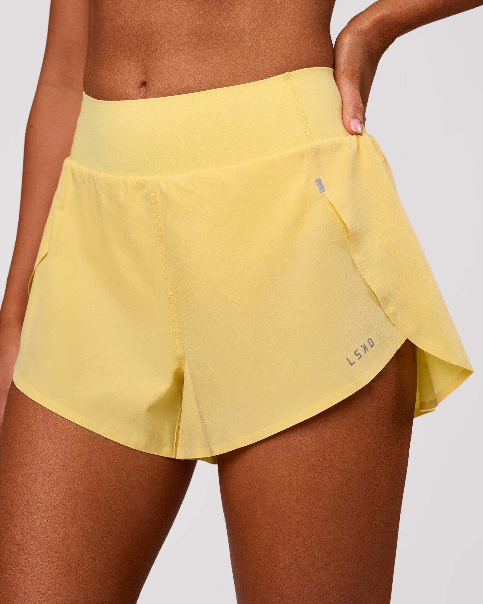 Woman wearing Pacer 3" Run Short - Lemon | Model:Charli | Size:XS