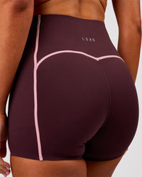 Woman wearing Power Ultra High-Rise 4" Short Pockets - Cherry Lacquer-Pink Rose | Model:Charli | Size:XS | Thumbnail Index: 1