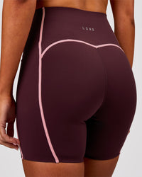 Woman wearing Power Ultra High-Rise 6" Short Pockets - Cherry Lacquer-Pink Rose | Model:Charli | Size:XS | Thumbnail Index: 1