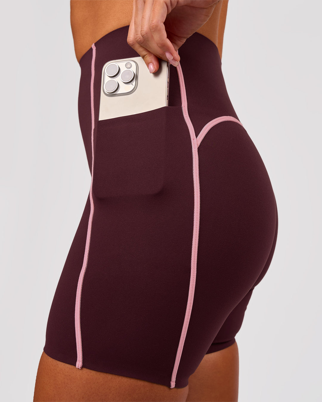 Woman wearing Power Ultra High-Rise 6" Short Pockets - Cherry Lacquer-Pink Rose | Model:Charli | Size:XS - view 3