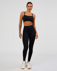 Woman wearing Solstice High-Rise Full Length Legging - Black | Model:Charli | Size:XS | Thumbnail Index: 5