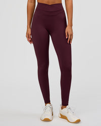 Woman wearing Solstice High-Rise Full Length Legging - Cherry Lacquer | Model:Charli | Size:XS | Thumbnail Index: 1