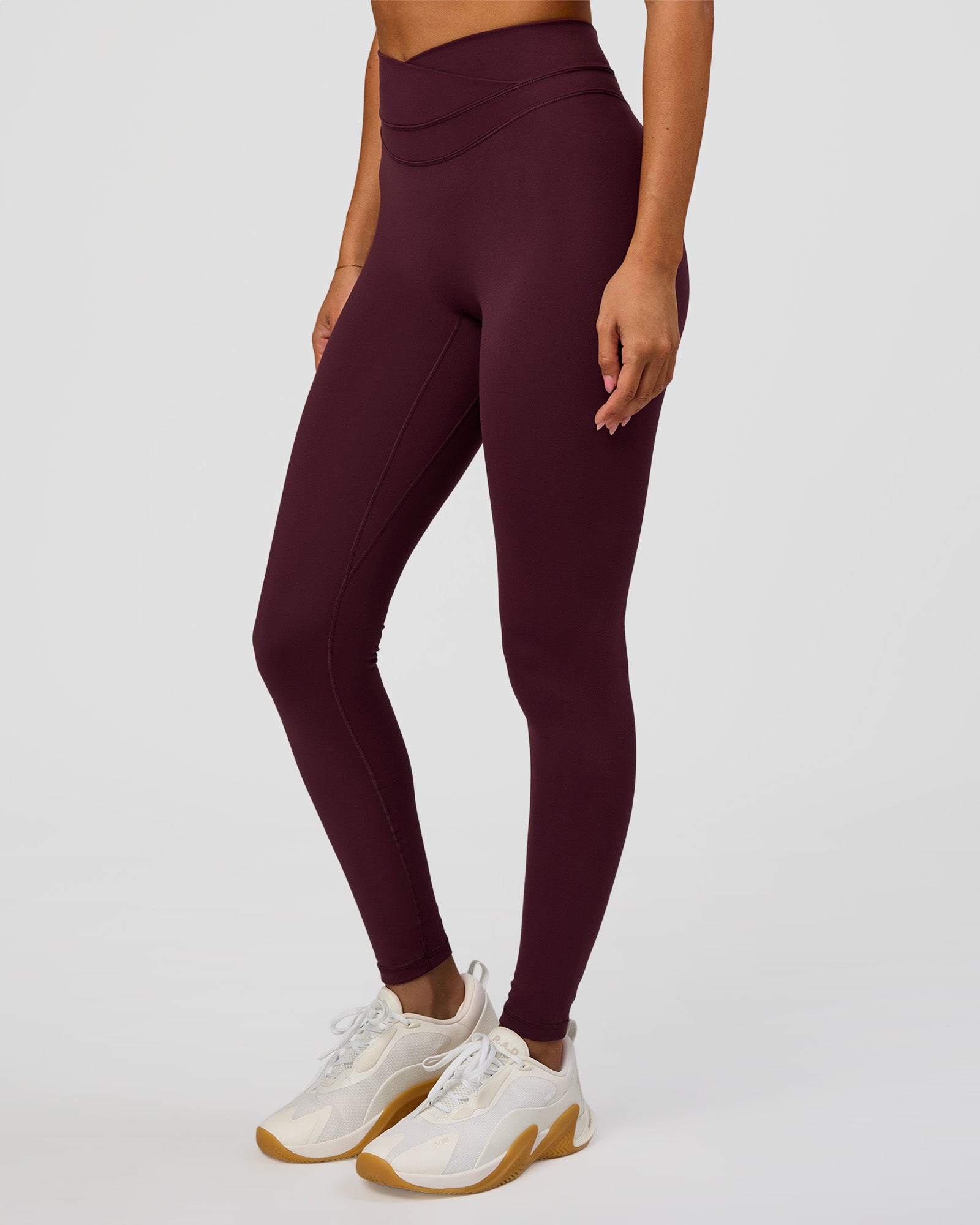 Woman wearing Solstice High-Rise Full Length Legging - Cherry Lacquer | Model:Charli | Size:XS
