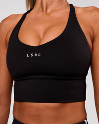 Woman wearing Stellar Long Line Sports Bra - Black-White | Model:Charli | Size:XS | Thumbnail Index: 2