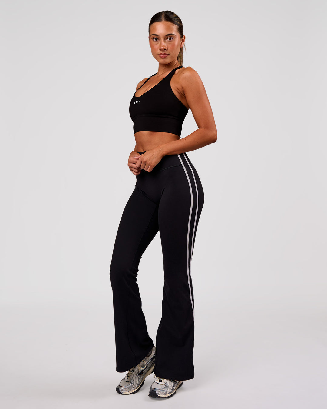 Woman wearing Stellar Long Line Sports Bra - Black-White | Model:Charli | Size:XS - view 6