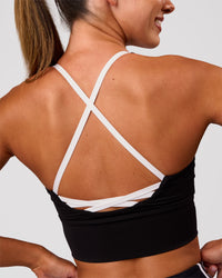 Woman wearing Stellar Long Line Sports Bra - Black-White | Model:Charli | Size:XS | Thumbnail Index: 10