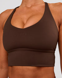 Woman wearing Stellar Long Line Sports Bra - Hot Chocolate | Model:Charli | Size:XS | Thumbnail Index: 2