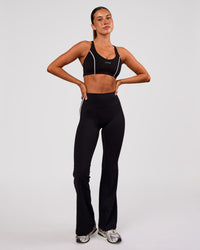 Woman wearing Stellar Sports Bra - Black-White | Model:Charli | Size:XS | Thumbnail Index: 2
