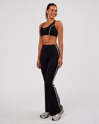 Woman wearing Stellar Sports Bra - Black-White | Model:Charli | Size:XS | Thumbnail Index: 3